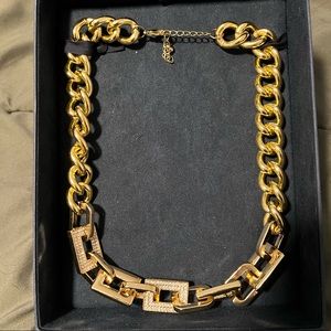 Costume jewelry. Large link gold colored necklace with rhinestone embellishments